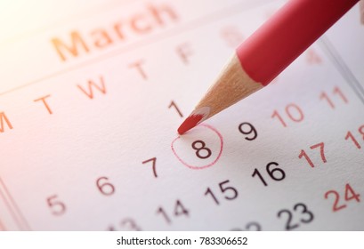 March 8, 2018. International Women's Day. Calendar And Dates. Red Circled Data With Pencil.