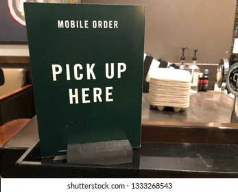 March 8, 2019 - Crystal, MN: Sign At A Starbucks Store - Mobile Order Pick Up Here. Customers Can Order Coffee Drinks Via The Mobile App Ahead Of Time And Skip The Line.