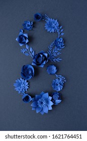 March 8 Women's Day card with blue paper flowers on black background.