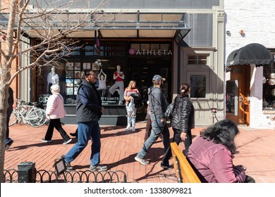 March 9th, 2019 - Boulder, Colorado USA - Athleta Storefront With People Walking Pearl Street Mall