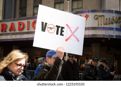 March For Our Lives: A Sign That Says Vote With A Drawing Of An AR-15 With A Slash Through It And Red X Referring To A Voting Ballot At The March To End Gun Violence On 6th Ave, NEW YORK MAR 24 2018.