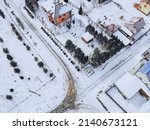 March in the village of Mansky, the snow began to melt, wooden cottages, photo from quadcopter