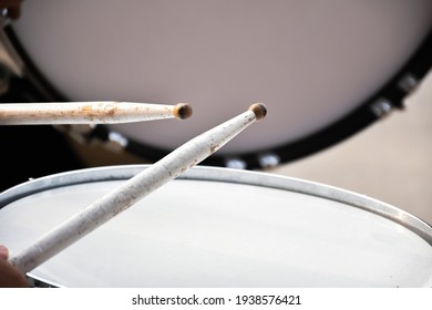 Marching Bass Drum, Snare Drum And Marching Mallets Holding In Hands.