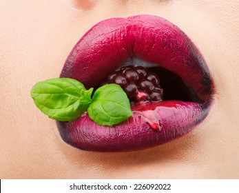 Marco Photo Of Female Lips With Berry