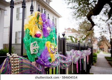 Mardi Gras Beads And Decorations On A Fence In The Garden District Of New Orleans Louisiana