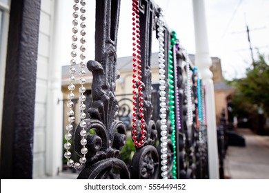 Mardi Gras Beads On A Fence In The French Quarter Of New Orleans