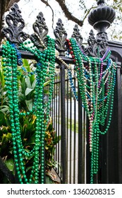 Mardi Gras Beads On An Iron Fence In The Historic New Orleans Garden District