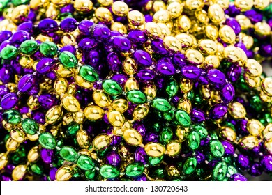 Mardi Gras Beads On White Backgound.