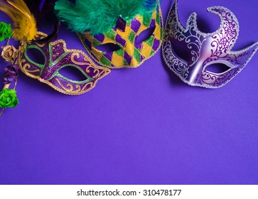 Mardi Gras or carnival mask on bright purple background