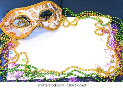 Mardi Gras Mask And Beads Frame For Text On White Space Background. Madi Gras Celebration Fat Tuesday Carnival