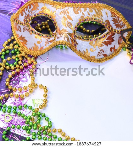 Mardi gras mask and beads frame for text on white space background. Madi gras celebration fat tuesday carnival