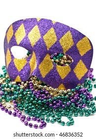 Mardi Gras Mask And Beads On White