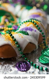 Mardi Gras: Traditional King Cake With Festive Beads And Coins