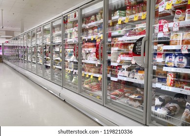 MARGARET RIVER, AUSTRALIA - JUNE 16, 2018: Interior view of huge glass freezer with various brand frozen foods in Coles store. Coles is an Australian supermarket, retail and consumer services chain.