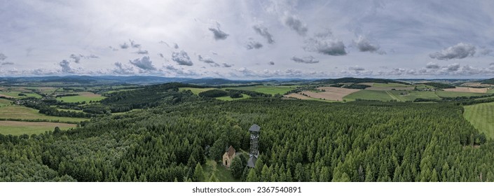 Margaret tower (Rozhledna sv. Marketa) close to Dlazovice,Klatovy, aerial panorama landscape view of lookout tower and small chapel next to it,Sumava mountains