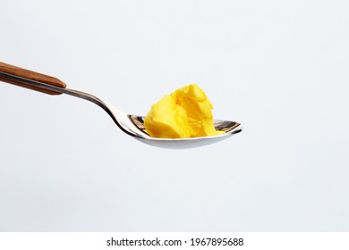 Margarine Cheese Butter In Spoon On White Background.