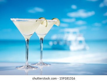 margarita  cocktail on beach, blue sea and sky background - Powered by Shutterstock