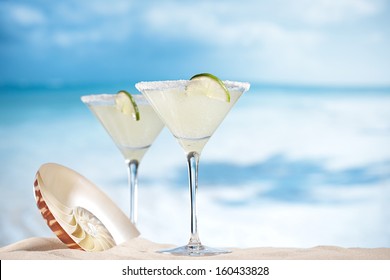 Margarita  Cocktail On Beach, Blue Sea And Sky Background