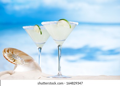 Margarita  Cocktail On Beach, Blue Sea And Sky Background