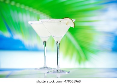 Margarita Cocktail On Beach, Blue Sea And Sky Background