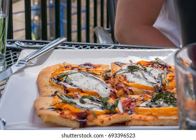 Margherita Flatbread Appetizer At An Outdoor Cafe