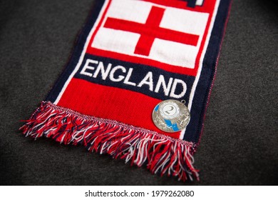 Mari El, Russia - May 10, 2021: Red Scarf Of A Great Britain Football Fan With The Inscription England. Silver Medal For The 2nd Place With Cup