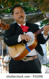 A Mariachi Band Player On Guitar At Jolly Boy Restaurant, In Old Town San Diego