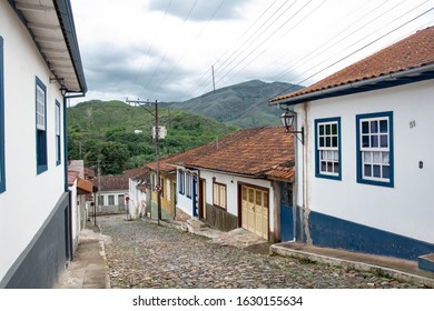 MARIANA, MINAS GERAIS, BRAZIL - DECEMBER 23, 2019: Colonial style houses with mountains in the background in Mariana, Minas Gerais - Brazil. Mariana is the oldest city in the state of Minas Gerais - Shutterstock ID 1630155634
