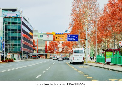 Maribor, Slovenia - January 16, 2019: White Touristic Bus In Road. Tour Modern Shuttle Bus Back On Highway. Urban Transport With Driver. Excursion Long Transit Vehicle