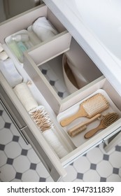 Marie Kondo's Method Organization Of Bathroom Amenities In Modern Open Shelf Case. Toiletries In White Stylish Drawer Or Cupboard Top View. Contemporary Tidying Up Or Storage Household Space