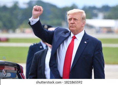 MARIETTA, GA- SEPTEMBER 25, 2020: President Donald Trump Gives A Fist Pump Arriving At Dobbins Air Reserve Base. He Will Be Speaking On Black Economic Empowerment At The Cobb Galleria Center.