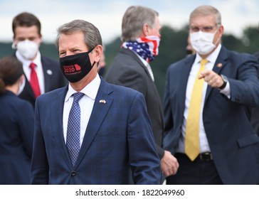 MARIETTA, GA- SEPTEMBER 25, 2020: Georgia Governor Brian Kemp Speaks With The Press As He Awaits President Trump's Air Force One Arrival At Dobbins Air Reserve Base Wearing A Census 2020 Face Mask.