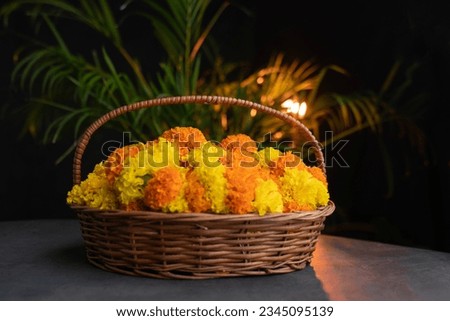 Marigold flower in a flower basket, Onam pookalam concept image, Diwali background