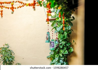 Marigold Flower And Green Leaf Decoration On Door For Welcome 