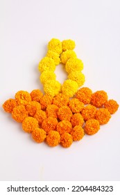 Marigold Flower Rangoli Design In Oil Lamp Shape.