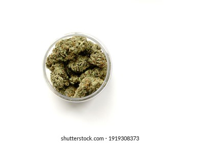 Marijuana buds storage. Medicinal cannabis flowering on white background, isolated. Hemp recreation, medical usage, legalization. 