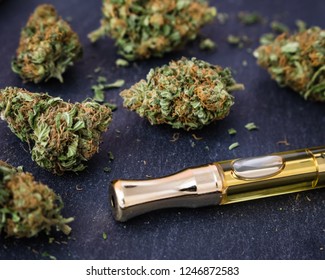 Marijuana Buds With A THC Oil Concentrate Filled Vape Pen