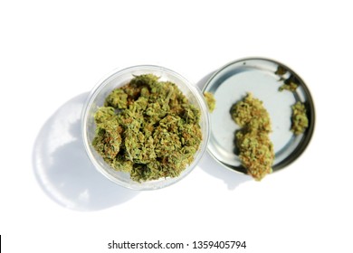 Marijuana. Cannabis. A jar of high grade medical or recreational marijuana. Isolated on white. Room for text. 