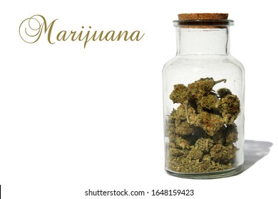 Marijuana. Cannabis Sativa or Cannabis Indica in a Glass Stash Jar with a cork lid. Isolated on white. Room for text. Clipping Path. Marijuana is enjoyed world wide and legal in many area of the world