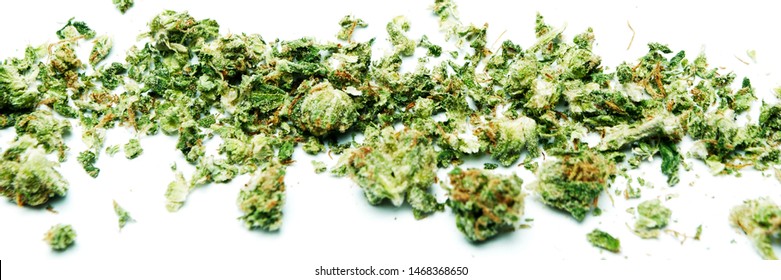 Marijuana and Cannabis Shake. Broken up Dried Weed and Pot. White Background Panorama. 
