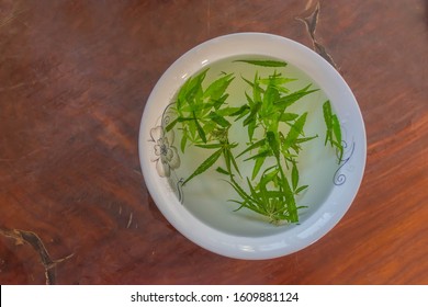 Marijuana herb tea in the bowl.