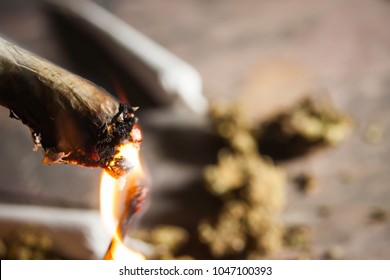 Marijuana Joint Being Lit With A Match For Smoking