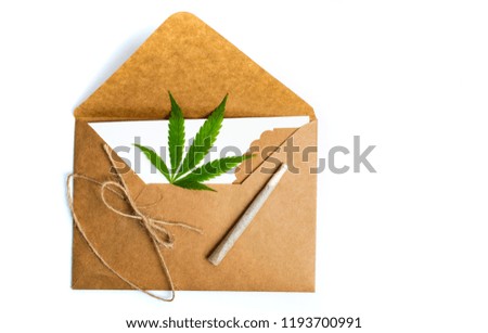 Marijuana leaf in an envelope on white isolated