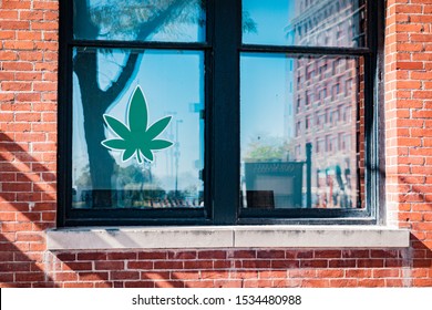 Marijuana Leaf In A Window Of A CBD Retail Store In Downtown Omaha Nebraska USA