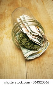 Marijuana Money, Foreign and American Currency and Cannabis Buds 
