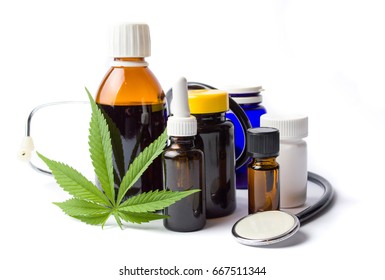 Marijuana plant and cannabis oil bottles isolated