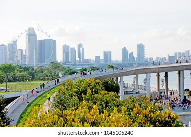 Marina Barrage, Singapore -
 September 5, 2017: People Come To Marina Barrage Park For Family Activity Picnic And Taking A Rest In The Parks.- Landscape City Travel And Outdoor Scenic 