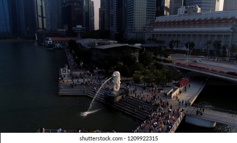 Marina Bay, Singapore May, 2018: View Of Business District And The Merlion Park. Moving Clouds With Singapore City Background. Shot. The Merlion Is National Personification Of Singapore. Top View Of