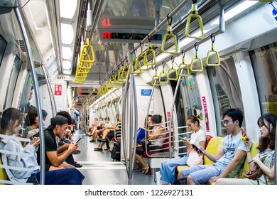 MARINA BAY, SINGAPORE - NOV 3, 2018: Interior Of Singapore MRT Circle Line C830 Trains With Moderate Number Of Passengers