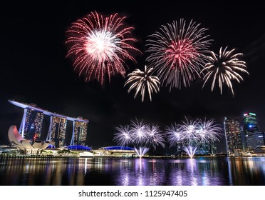 Marina Bay Skyline During Night Time With National Day Fireworks Show. Singapore.